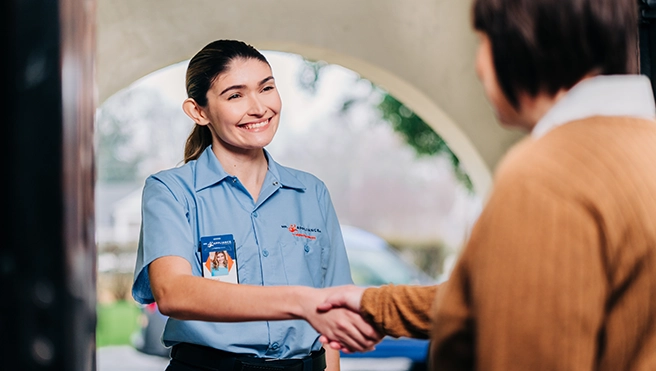Mr. Appliance service professional providing repairs.