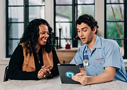 Mr. Appliance tech reviewing information on an ipad.